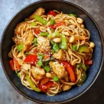 Kung Pao Chicken is a beloved dish that finds its roots deep within the rich tapestry of Chinese cuisine. Originating from the Sichuan province, this culinary masterpiece has captivated taste buds worldwide with its unique blend of flavors and textures. Traditionally, Kung Pao Chicken features diced chicken stir-fried with peanuts, vegetables, and a signature spicy sauce, creating a dish that is both savory and slightly sweet. However, in this recipe, we will take this classic dish to new heights by transforming it into Kung Pao Chicken Noodles—a delightful fusion that combines the essence of Kung Pao with the comforting appeal of noodles.
