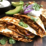 In the realm of quick and satisfying meals, few dishes can compete with the allure of BBQ Chicken Quesadilla Fiesta. This vibrant and flavorful dish perfectly marries the smoky sweetness of BBQ chicken with the gooey goodness of melted cheese, all nestled between crispy, golden tortillas. Whether you're looking for a speedy weeknight dinner, a savory snack for game day, or a fun dish to share at casual gatherings with family and friends, this quesadilla recipe is sure to impress.